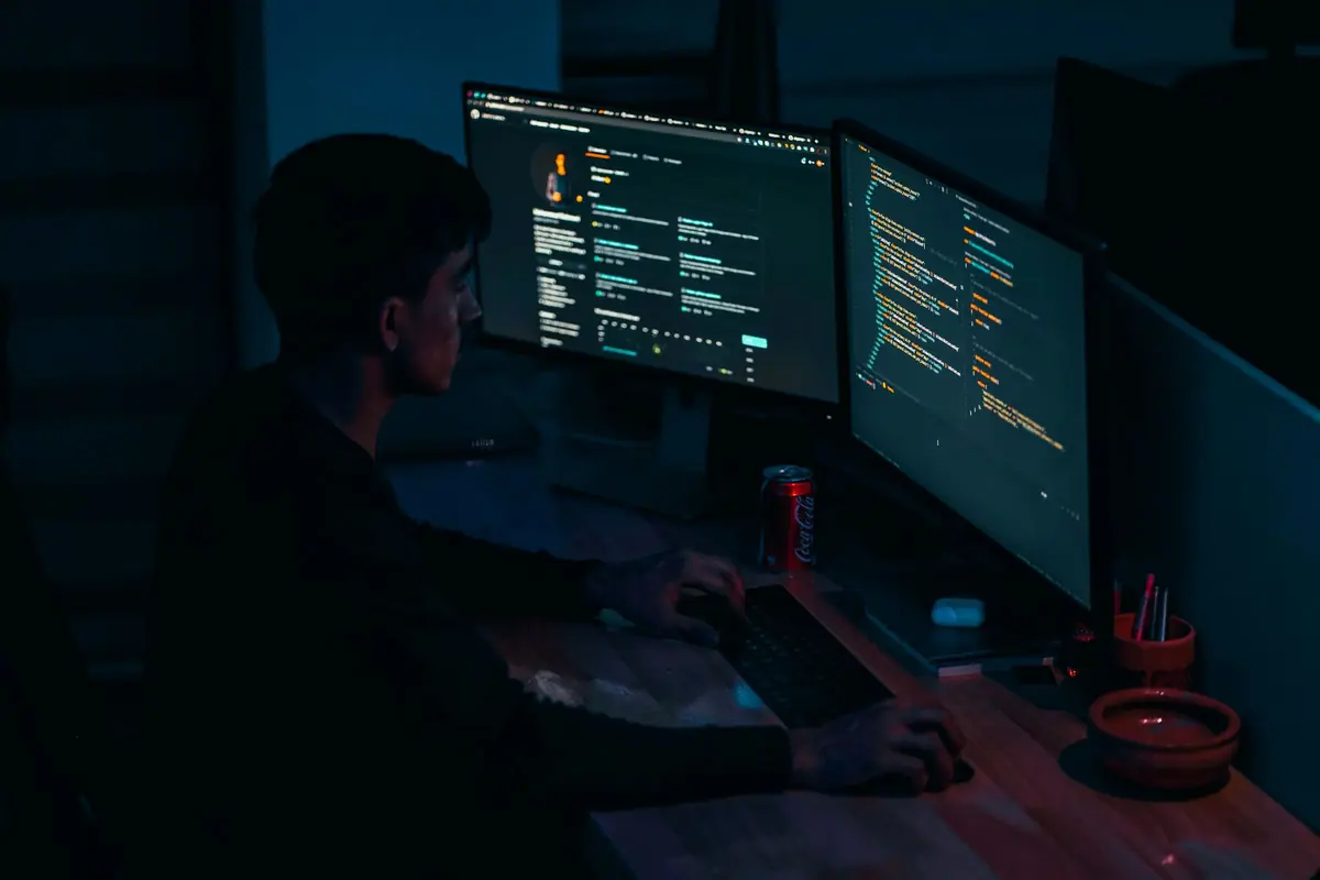 A person using a computer at a desk.